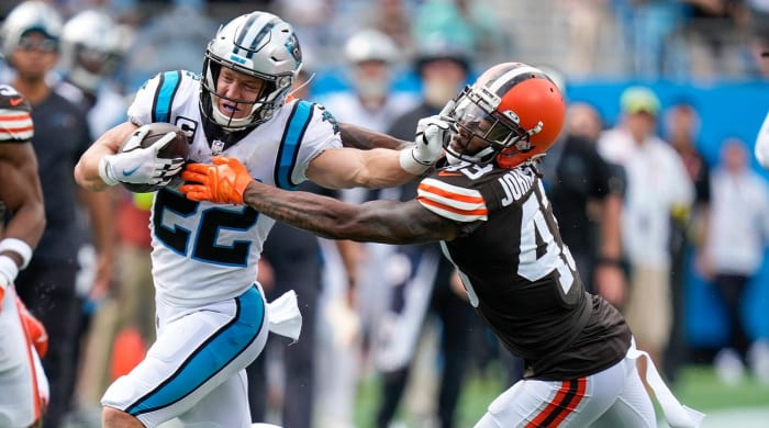Sep 11, 2022; Charlotte, North Carolina, USA; Carolina Panthers running back Christian McCaffrey (22) stiff arms Cleveland Browns safety John Johnson III (43) during the second half at Bank of America Stadium.